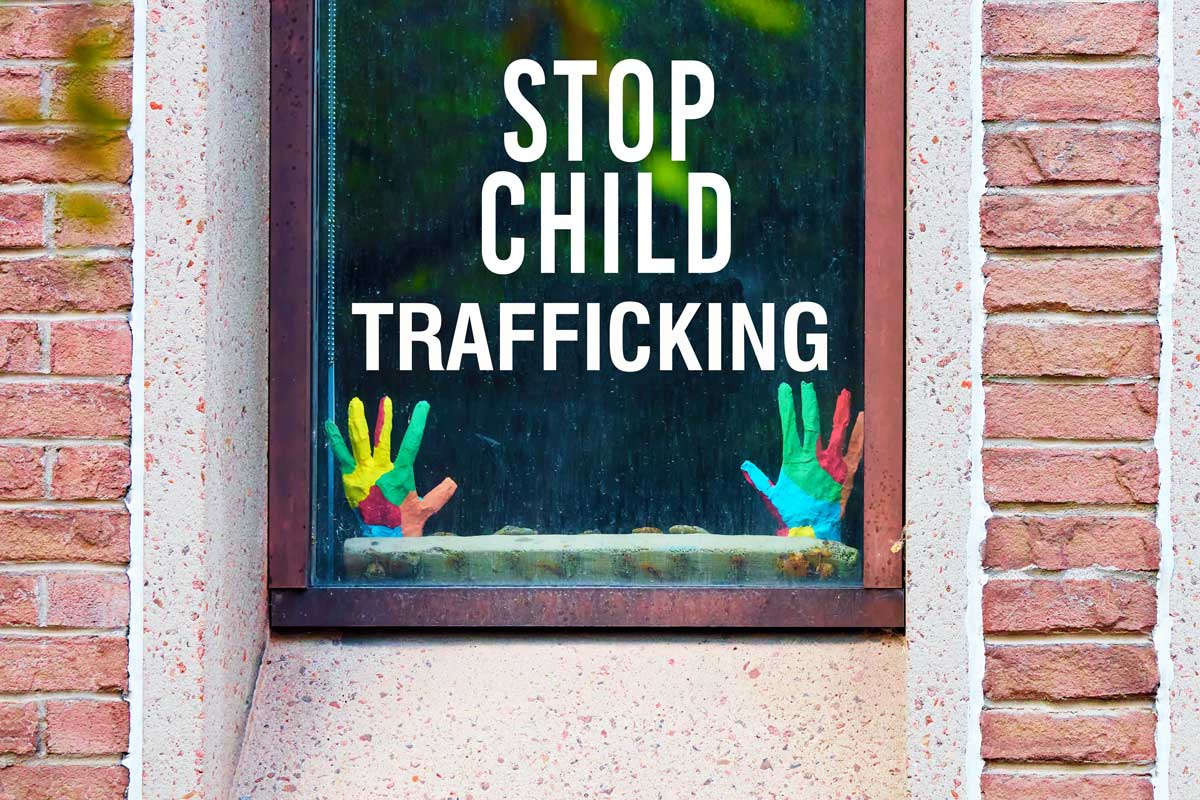 Window that says Stop Child Trafficking